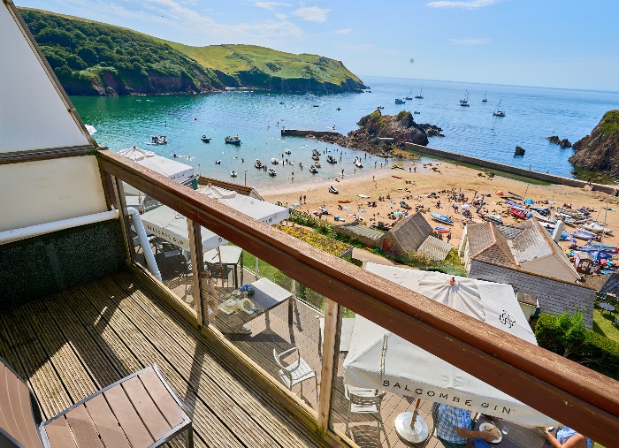 view from private balcony room of hope cove sandy beach